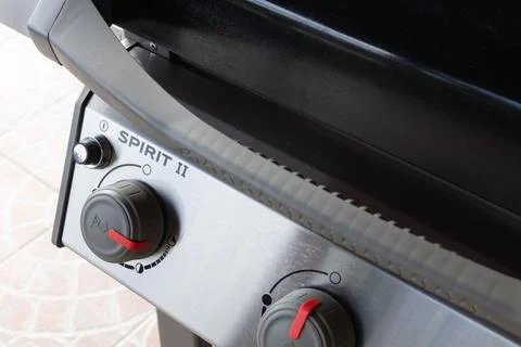 Close-Up of a BBQ Grill Control Panel Featuring Spirit II Ignition Knob Stock Photos