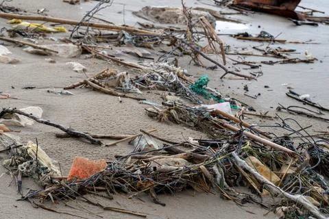 Close up of beach pollution. Garbage plastic, bottles, other unnecessary garb 스톡 사진