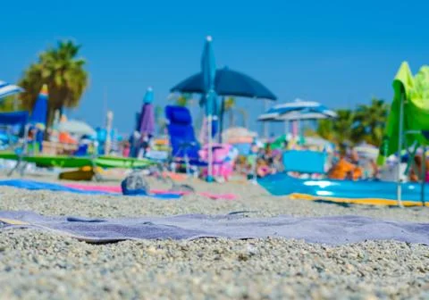 Close-up of a beach tablecloth lying on the beach. Background all out of focu Stock Photos