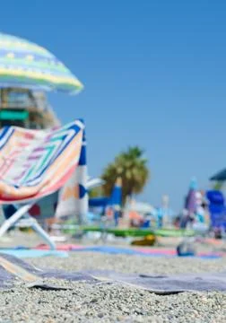 Close-up of a beach tablecloth lying on the beach. Background all out of focu Stock Photos