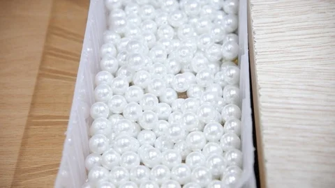 Close-up beads and sequins, of needle and thread, embroider pattern. Equipment Stock Footage 89927589