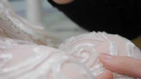 Close-up beads and sequins, of needle and thread, embroider pattern. Equipment Stock Footage 89928798