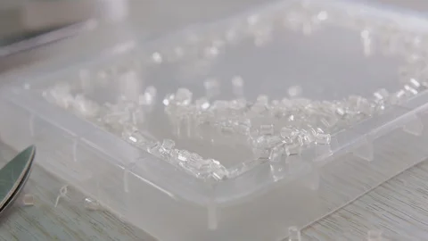 Close-up beads and sequins, of needle and thread, embroider pattern. Equipment Stock Footage 89928823