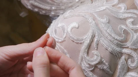 Close-up beads and sequins, of needle and thread, embroider pattern. Equipment Stock Footage 89929017