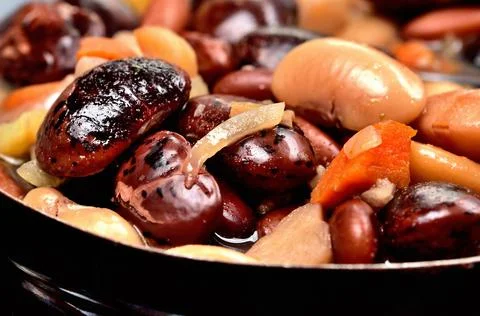 Close-up of bean soup with large beans in an old enamel pot Stock Photos