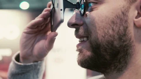 Close-up bearded attractive man uses virtual reality glasses Stock Footage 72225958