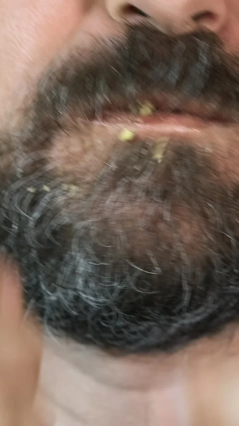 Close-up, bearded man eats, fast food, fluted chips. Stock Footage 305849326