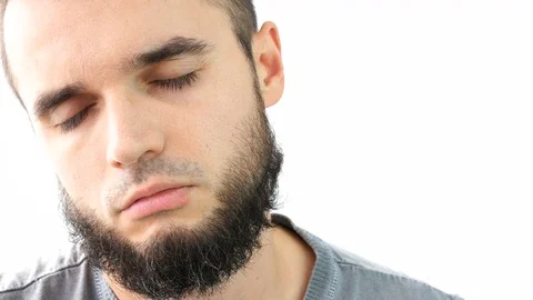 Close-up of bearded man sleeping and waking up 库存影片 75386280