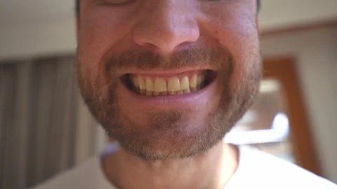 Close up of a bearded man smiling widely unrecognizable Stock-Footage 328228499