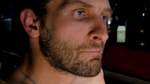 Close-up of bearded thinks while writing program code Stock Footage 105337075