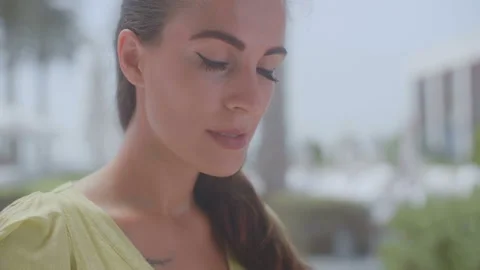 Close-up of a beautiful brunette in a cafe. Slow motion video Stock Footage 92022853