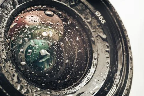 Close up beautiful Camera lens of drop water, on a white Background pattern f Stock Photos