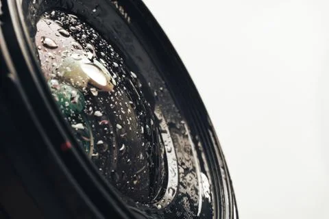 Close up beautiful Camera lens of drop water, on a white Background pattern f Stock Photos