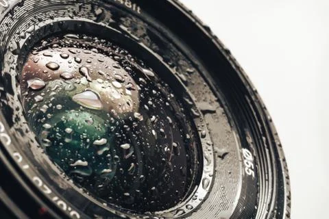 Close up beautiful Camera lens of drop water, on a white Background pattern f Stock Photos