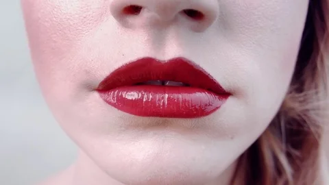Close-up beautiful chubby lips with bright juicy red lipstick. Stock Footage 84142804