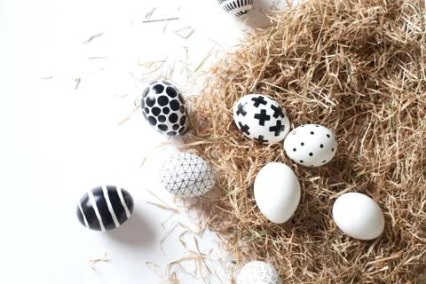 Close-up beautiful eggs of different sizes. Nordic style Stock Photos