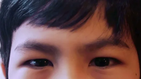 Close up of beautiful eye of multiethnic child Stock Footage 74850011