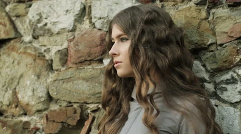 Close Up Of Beautiful Fashion Model Posing At Natural Stone Wall In Magic Light Stock Footage 46499113