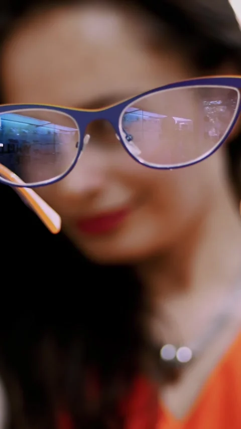 Close-up, a beautiful female frame, goggles, a woman is holding glasses in her Stock Footage 317534043