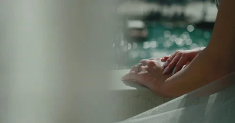 Close-up of beautiful female hands on the background of a view from the window Stock Footage 229641872