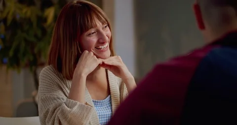 Close up of beautiful female smiling while communicating with best friends at Stock Footage 123667793