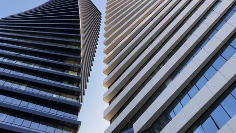 Close-up beautiful geometric background of two modern high-rise buildings. Stock Footage 243209138