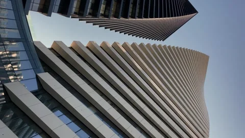 Close-up beautiful geometric background of two modern high-rise buildings. Stock Footage 243719958