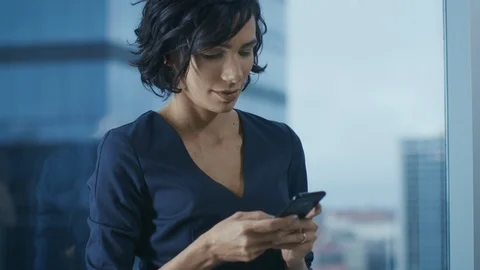 Close-up of the Beautiful Hispanic Woman Using Smartphone. Business Lady in Form Stock Footage