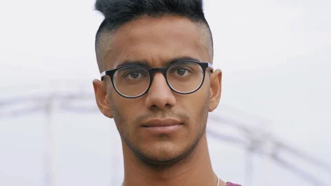 Close-up Beautiful Indian Guy in Spectacles Looks Serious Look Stock Footage 95406313