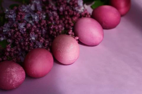 Close-up of beautiful lilac Easter eggs with blooming lilac branches. Easter 写真素材