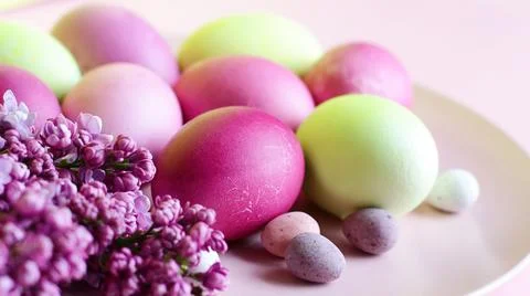 Close-up of beautiful lilac Easter eggs with blooming lilac branches. Easter 写真素材