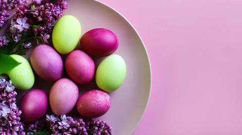 Close-up of beautiful lilac Easter eggs with blooming lilac branches. Easter 写真素材