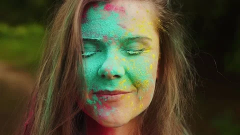 Close up beautiful long-haired smiling girl with colourful make up opening eyes Stock Footage 151109906