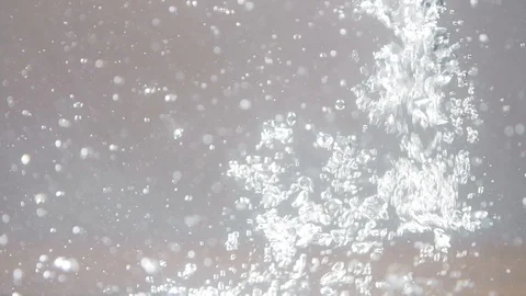 Close-up beautiful macro shot of small air bubbles in water rising in slow Stock Footage 107436084