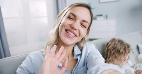 Close up of beautiful mom talking video calling from home while child daughter Stock Footage 132321164