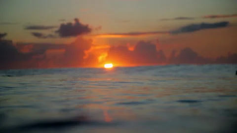 Close-Up Beautiful Shot Of Waves During Sunset Against Orange Cloudy Sky - Oahu, Stock Footage 154607301