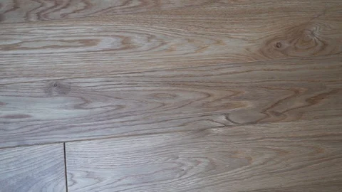 Close-up beautiful solid wood floor Board parquet light oak, circular slide came Stock Footage 118818039