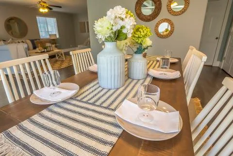 Close up of a beautiful table setting at the dining room of a home Stock Photos