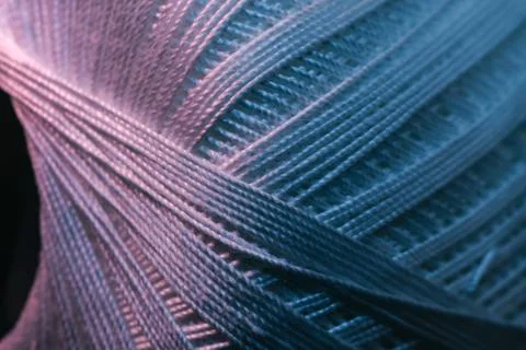Close up beautiful tangle of thread in red and blue light on a dark backgroun Stock Photos