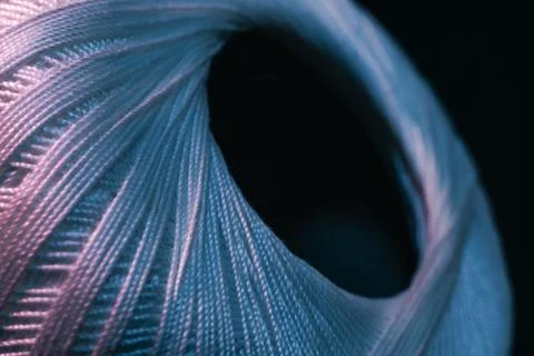 Close up beautiful tangle of thread in red and blue light on a dark backgroun Stock Photos