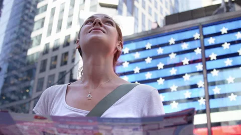 Close-up of beautiful tourist looking at map in Times Square, NYC in 4K Stock Footage 54259630