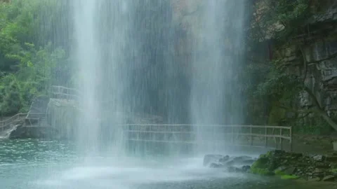 Close up of Beautiful waterfall. Bold granite cliffs around at the bottom 스톡 동영상 133353612