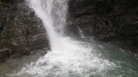 Close up of the beautiful waves in the deep pool at the lower of the waterfall. Stock Footage 260238558