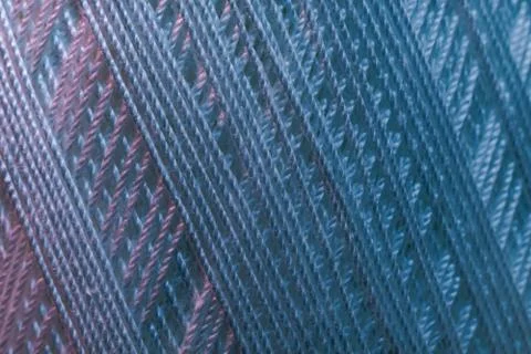 Close up beautiful white thread in red and blue light background texture. Mac Stock Photos