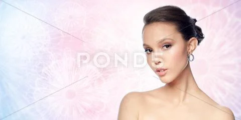 Close up of beautiful woman face with earring Stock Photos