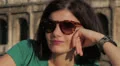 close-up of a beautiful woman smiling near Colosseum - coliseum - colosseo HD Footage