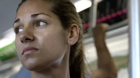 Close-up of beautiful woman's face on crowded subway riding 7 train in NYC in 4K Stock Footage 54261271