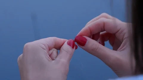 Close up of beautiful womans hands preparing fishing tackles Stock Footage 122955497