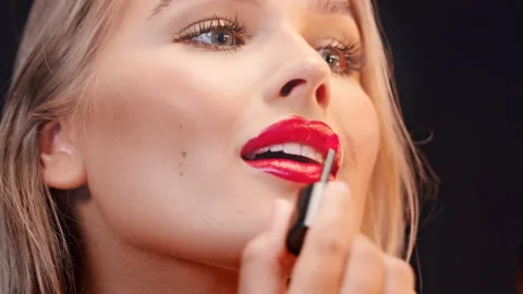 Close Up of a Beautiful Young Caucasian Make-Up Artist Doing Her Lips Stock Footage 164989634