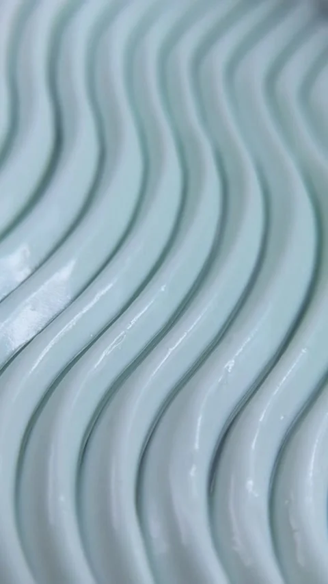 Close up of beauty cream featuring an elegant wave pattern. Self care produ.. Stock Footage 340144419
